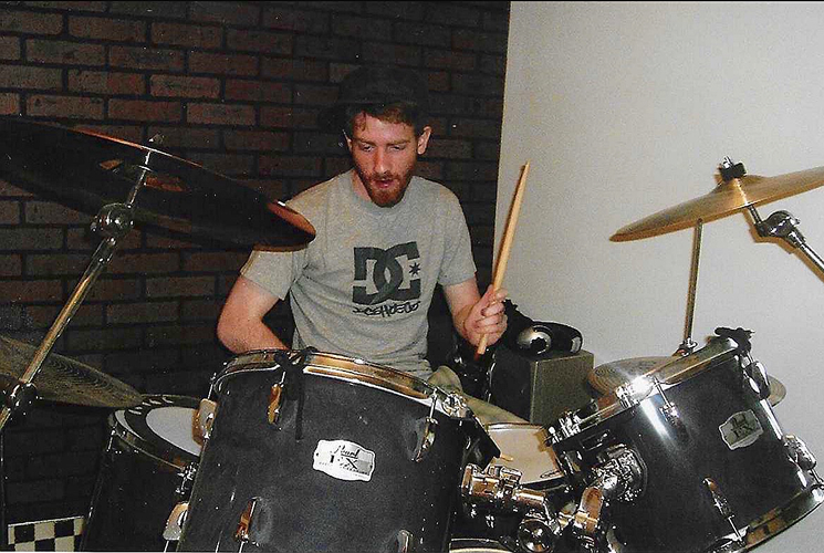 Playing on the drum kit as a teenager in West Virginia
