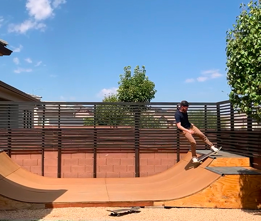 Skating on the backyard miniramp